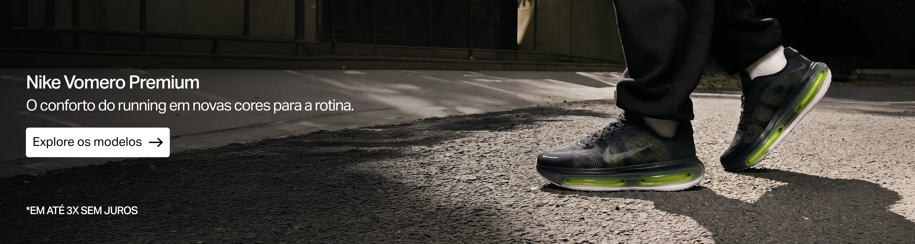 Nike Vomero Premium preto com amortecimento verde em foto de campanha